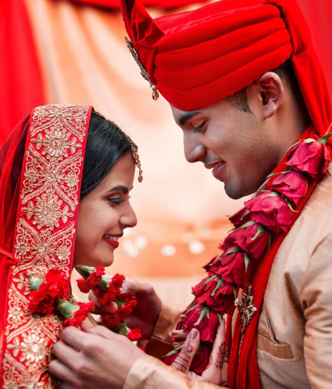 cropped-shot-of-a-young-hindu-couple-on-their-wedd-2023-11-27-05-32-19-utc (1)